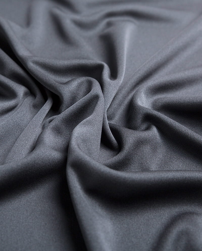 Stretch og elasticitet af strikkede stoffer: Hvorfor er de velegnede til sportstøj og aktivt tøj?